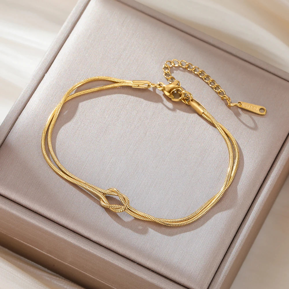 Elegant Double Snake Chain Love Knot Bracelet in Stainless Steel - Adjustable Gold Color Jewelry for Women and Couples