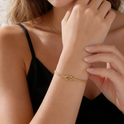 Elegant Double Snake Chain Love Knot Bracelet in Stainless Steel - Adjustable Gold Color Jewelry for Women and Couples